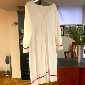 White linen dress with red trim